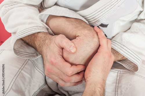 Brazilian jiu-jitsu training demonstration in traditional kimono