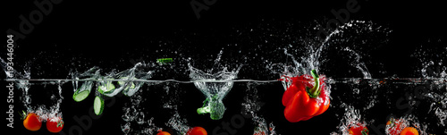 group of vegetables in water splash