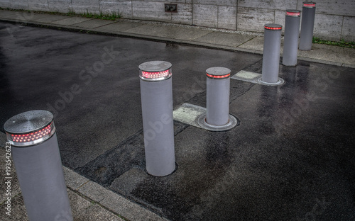 Retractable (lifting) bollards with warning light to enable or block traffic