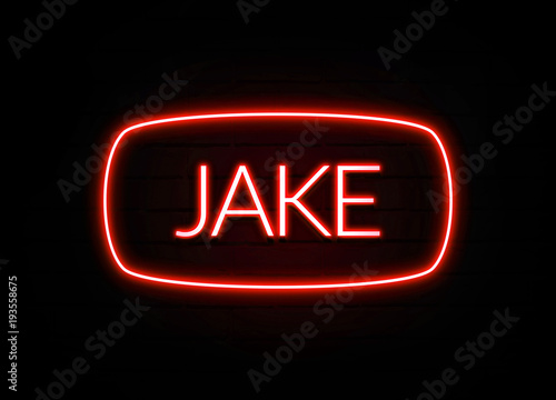 Jake neon sign on brick wall background.