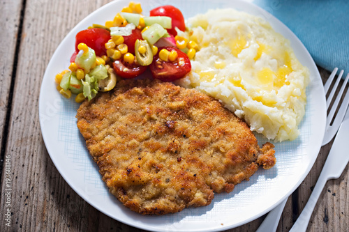 Polish breaded pork cutlet with mashed potatoes and salad 