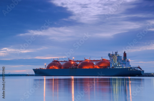 LNG TANKER AT THE GAS TERMINAL - Sunrise over the ship and port