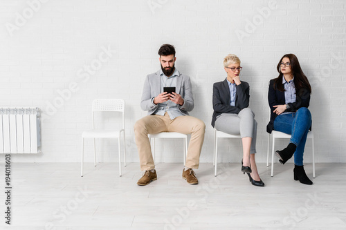 Young modern business people waiting for job interview 
