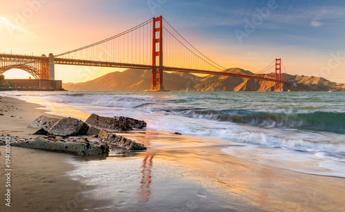 Sunset at the beach by the Golden Gate Bridge in San Francisco California