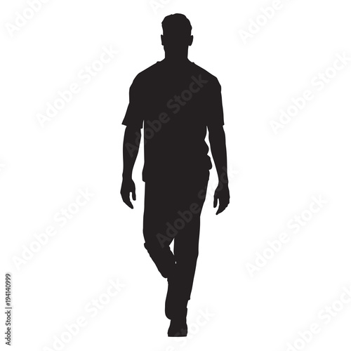 Handsome man in t-shirt walking forward, isolated vector silhouette, front view