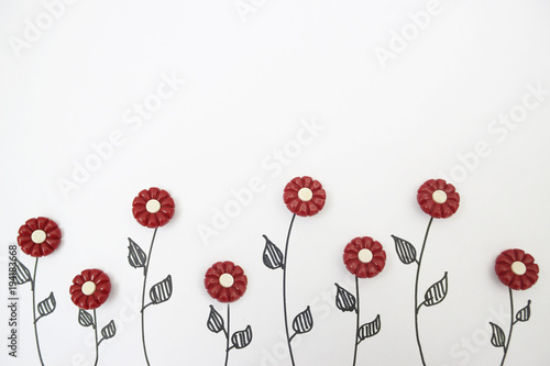 flowers from buttons on a white background. view from above. children's background