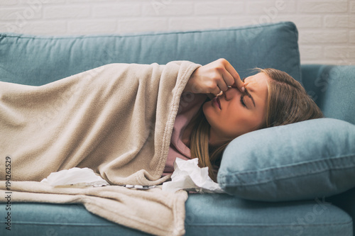 Woman having pain in sinus and fever.