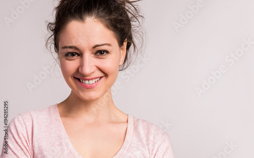 Portrait of a young beautiful woman in studio.