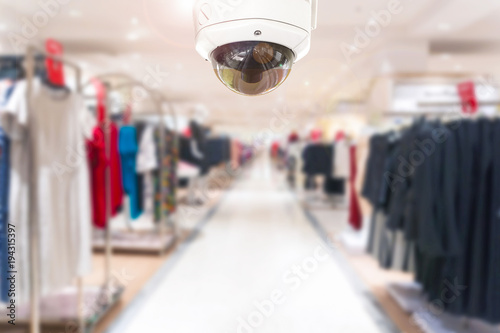 CCTV Security camera shopping department store on blurry background.