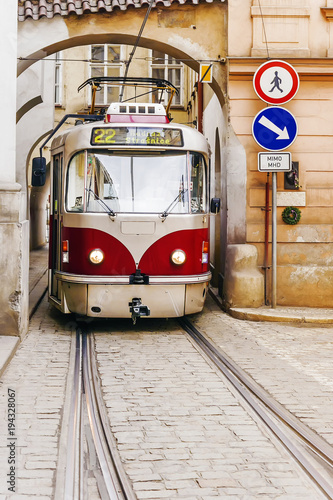 old red tram in the old streets of Prague