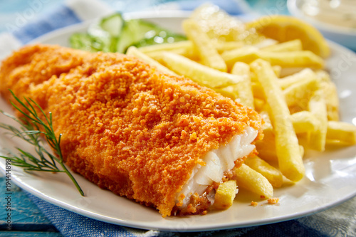 Portion of crispy fish with french fries