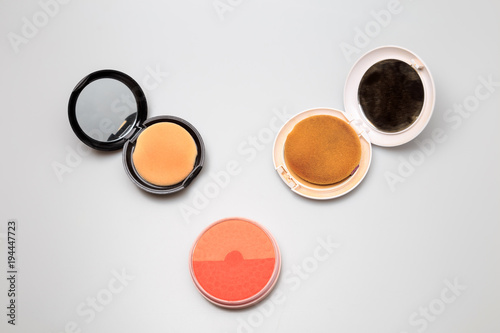 Makeup products on white background