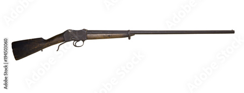 old hunting shotgun with a darkened cracked butt, remade from an army rifle, isolated