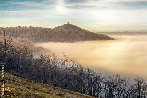 János Hill in Budapest with distant Elizabeth Lookout on top. Autumn, fog