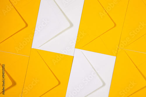 White and yellow envelopes on the table