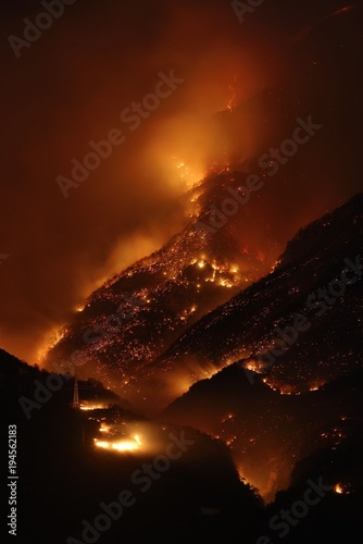 Night photography of a fire apocalypse in a mountain forest