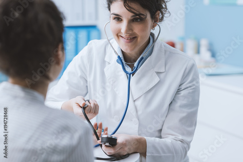 Doctor measuring blood pressure