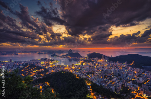 Rio de Janeiro skyline panorama at sunrise, Brazil. Sugarloaf Mountain and Botafogo Bay