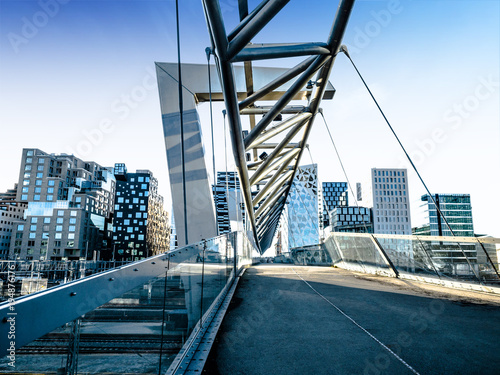 Beautiful different modern buildings, bridge from Oslo's Barcode district rises from the fjord like an urban and super trendy in Norway. 22 November 2017, Oslo Norway