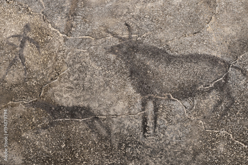 An image of an ancient man, animals on a cave wall. history. archeology. stone Age.