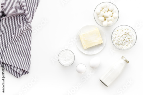 Fresh dairy products. Milk, cottage, cheese, yougurt on white table top view copy space. Monochrome