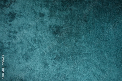 Dark green velvet fabric surface from above