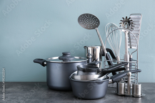 Metal cooking utensils on table