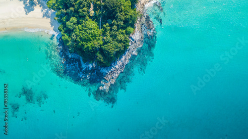 Aerial view tropical island with white sand beach and blue clear water and granite stones at Andaman sea, View from above beautiful beach of Andaman sea, Phuket, Thailand, Asia