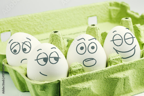 Four eggs in eggbox. Types of temperaments. Sanguine, choleric, phlegmatic and melancholic.