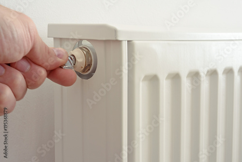 The man venting heating radiator