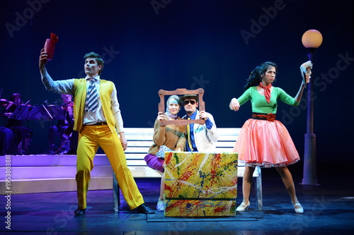 Young actors and Actresses dance on the stage of the theater