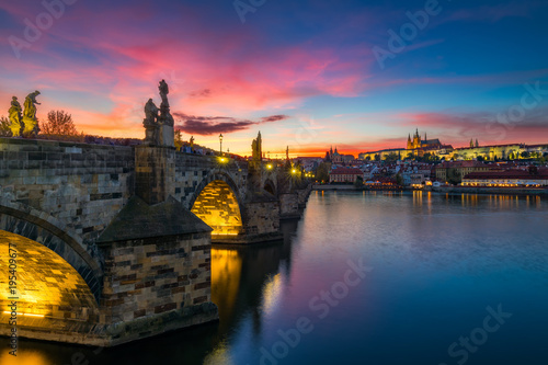Famous iconic image of Charles bridge at sunset in spring, Prague, Czech Republic. Concept of world travel, sightseeing and tourism.