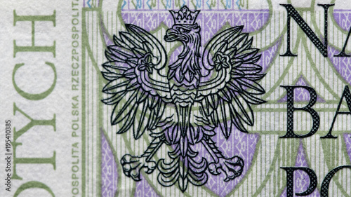 Close up on national emblem eagle of new Polish banknotes hundred zloty