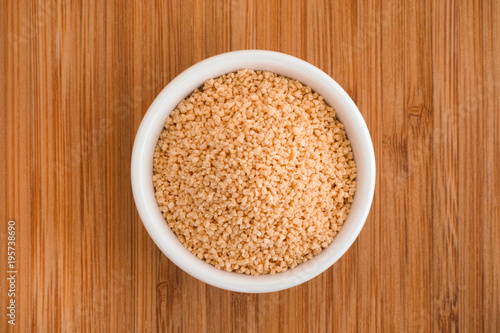  Soy lecithin in a bowl on a wooden background