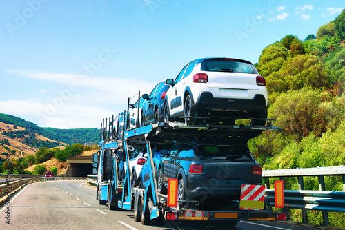 Car transporter on road in Nuoro Sardinia
