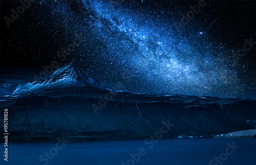 Milky way and volcanic mountain over fjord at night, Iceland