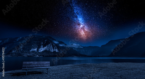 Mountain and lake at night with stars