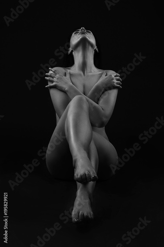 Sexy body nude woman. Naked sensual beautiful girl. Artistic black and white photo.