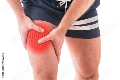 Man with quadriceps pain over white background