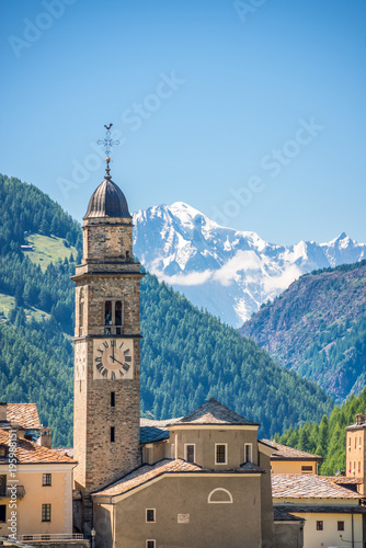 Church of Cogne, Monte Bianco (Mont Blanc) in the background, Grand Paradiso National park, Aosta Valley in the Alps, Italy
