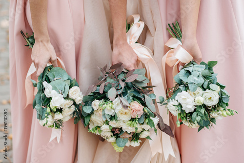 Wedding flowers in hand the bride and her bridesmaids.