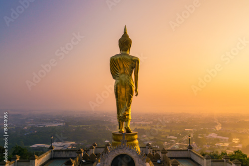 Golden Buddha Statue Beyond Nan City in the Morning, Thailand