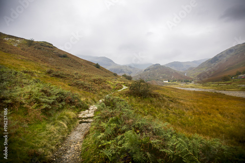 Hiking trails in the rolling hills of England's Lakes District. This area, known as The Old Man of Coniston, is known for its abandoned mines, wildlife, and incredible views.