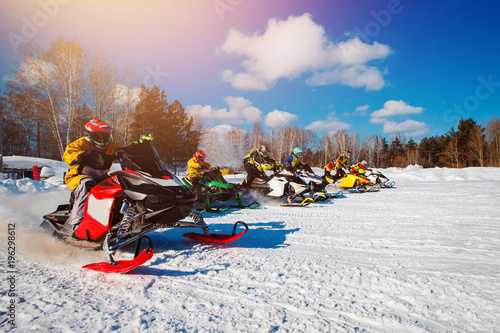 Snowmobile. Snowmobile races start in snow. Concept winter sports, racers.