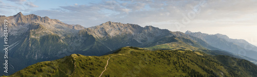 aerial image of green meadows in a mountain landscape at Isère