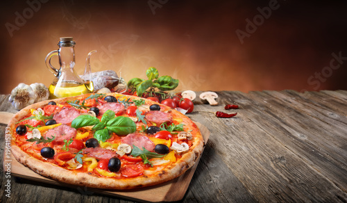 Hot Pizza Served On Old Table 