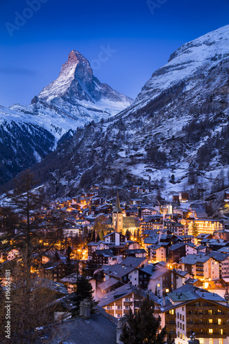 The world-famous Matterhorn glows in the early morning above the Swiss village of Zermatt, as the sun prepares to rise over the Alps.