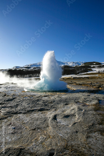 Water geyser in the Island on the blue sky background 