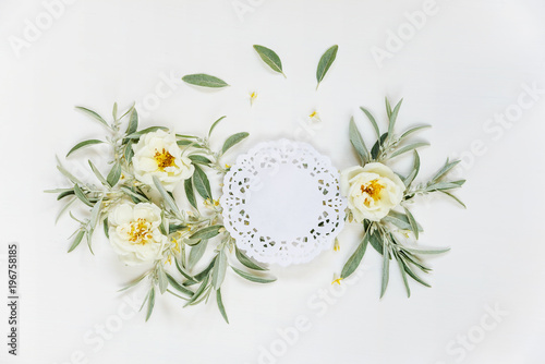 Decorative composition with lace paper napkin and rose flowers