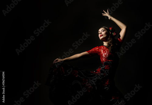 flamenco dancer on a dark background. free space for your text